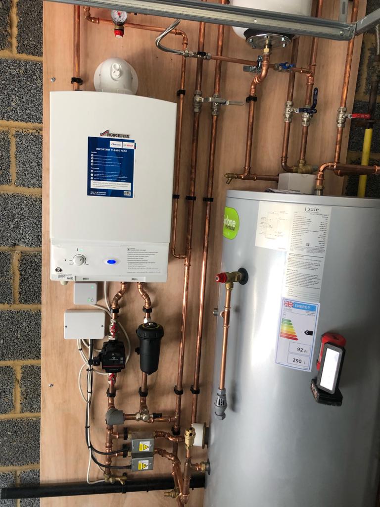 A new boiler and cylinder, piped in copper and left tidy.